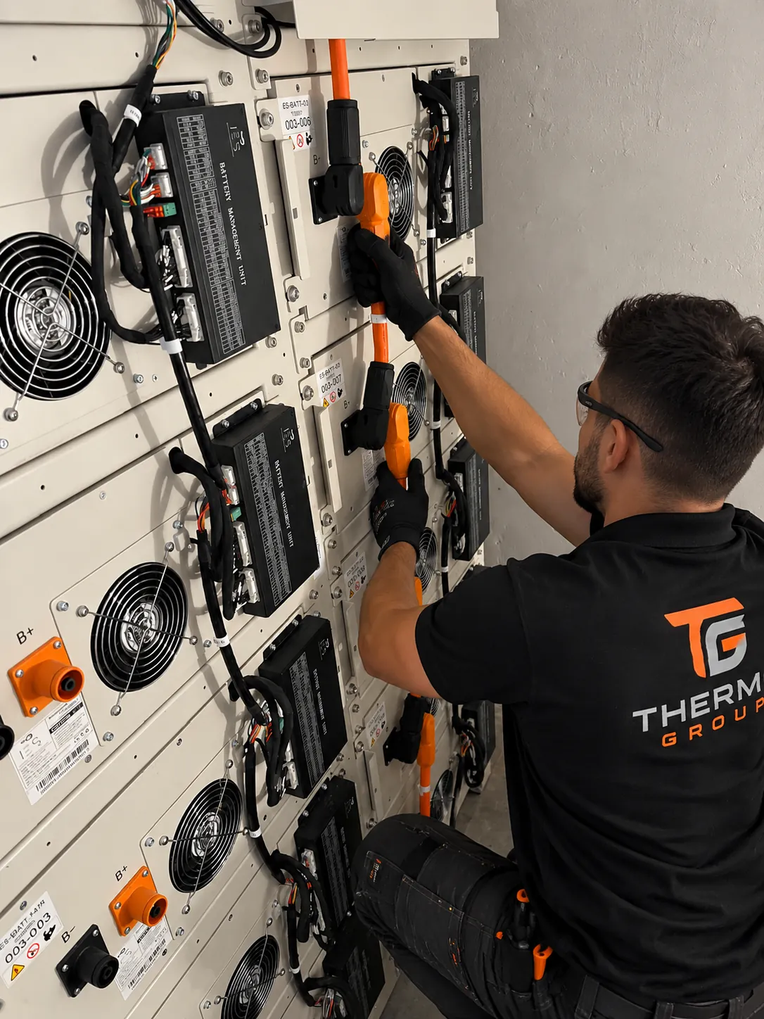 Thermo Group technician installing a large battery bank in Somerset West
