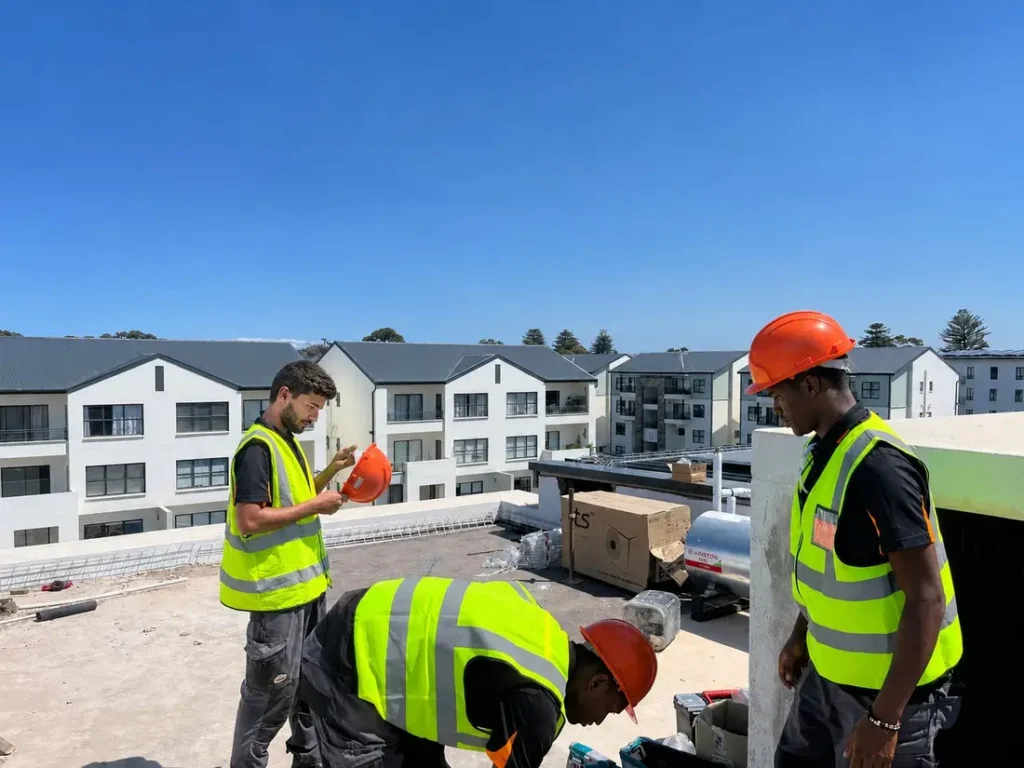 Thermo Group installation crew working on a rooftop solar installation in Century City, Cape Town