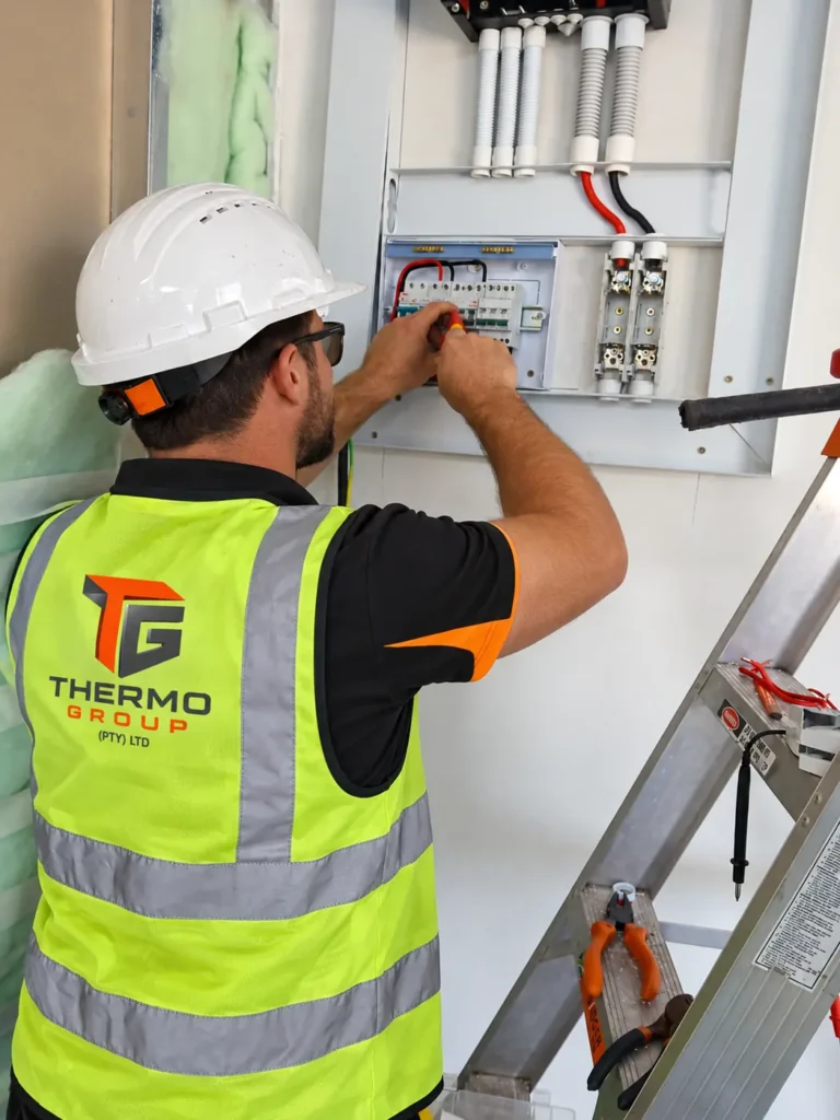 Thermo Group electrician wiring a distribution board on a compliance job in Rondebosch, Cape Town