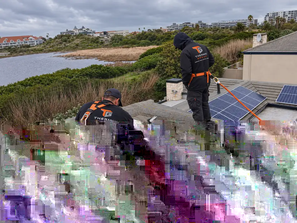 Rooftop solar panel installation by Thermo Group overlooking a Durbanville estate and lagoon, Cape Town