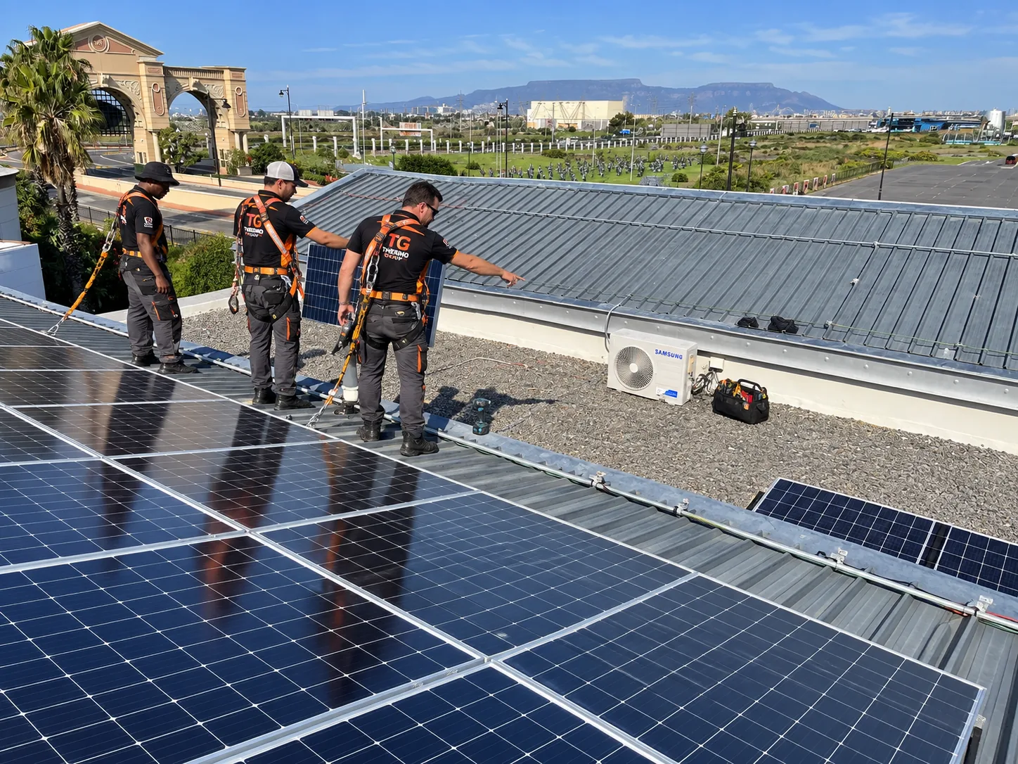 Thermo Group solar installation team on a rooftop at a Century City business park in Cape Town