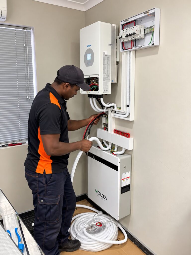 Thermo Group technician installing a Deye hybrid inverter and Volta battery in Cape Town